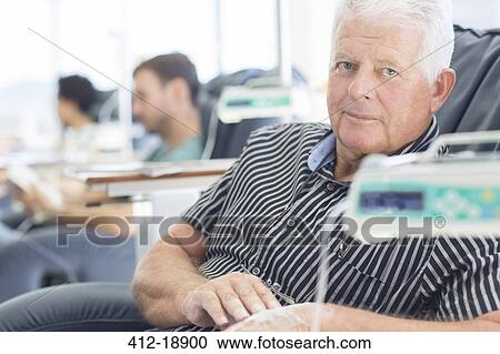 Stock Image - Portrait of patient undergoing medical treatment in outpatient clinic. Fotosearch