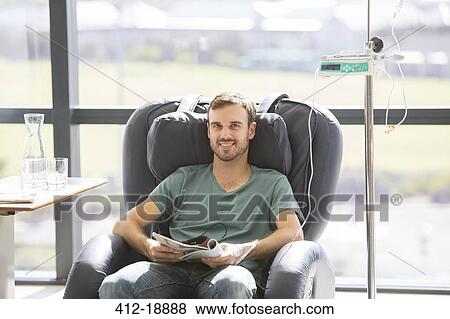 Portrait of smiling patient undergoing medical treatment in outpatient clinic View Large Photo Image Stock Photo - Portrait of smiling patient undergoing medical treatment in outpatient clinic. Fotosearch
