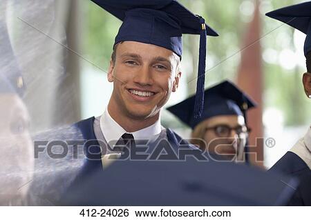 Portrait of smiling student during graduation ceremony View Large Photo Image Stock Photograph - Portrait of smiling student during graduation ceremony. Fotosearch