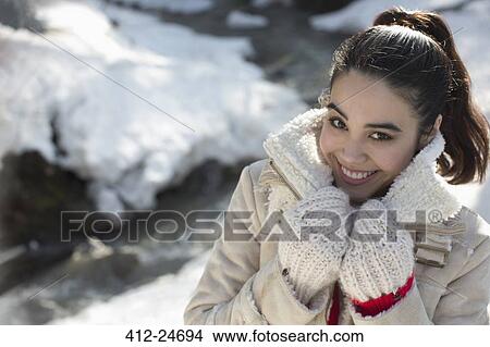 Portrait of smiling woman in snow View Large Photo Image Picture - Portrait of smiling woman in snow. Fotosearch