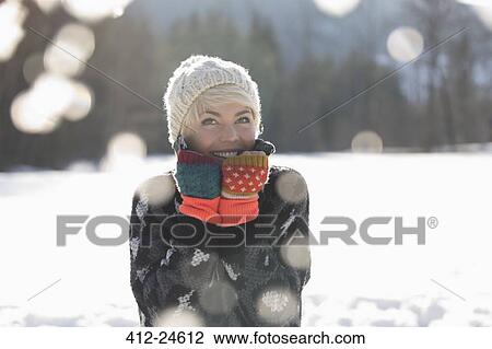 Portrait of smiling woman in snow View Large Photo Image Stock Image - Portrait of smiling woman in snow. Fotosearch