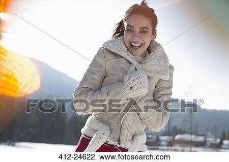 Portrait of smiling woman in snow View Large Photo Image Stock Image - Portrait of smiling woman in snow. Fotosearch