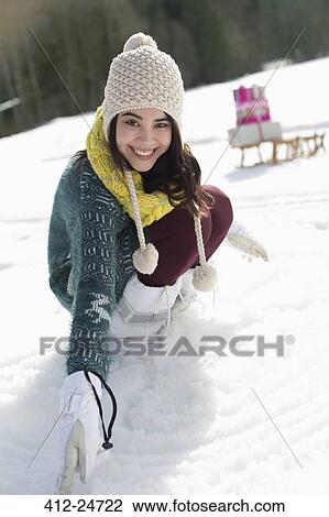 Portrait of smiling woman in snow View Large Photo Image Stock Image - Portrait of smiling woman in snow. Fotosearch