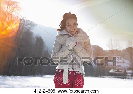 Portrait of smiling woman in snow View Large Photo Image Stock Photograph - Portrait of smiling woman in snow. Fotosearch