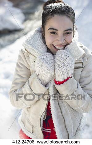 Portrait of smiling woman in snow View Large Photo Image Stock Photograph - Portrait of smiling woman in snow. Fotosearch