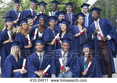 Portrait of university students in graduation gowns outdoors View Large Photo Image Stock Image - Portrait of university students in graduation gowns outdoors. Fotosearch
