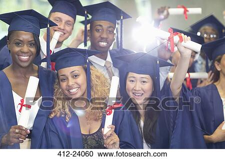 Portrait of university students standing in corridor after graduation ceremony View Large Photo Image Stock Image - Portrait of university students standing in corridor after graduation ceremony. Fotosearch