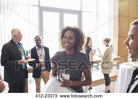 Portrait of young businesswoman standing in hall, with champagne flute in hand View Large Photo Image Stock Image - Portrait of young businesswoman standing in hall, with champagne flute in hand. Fotosearch