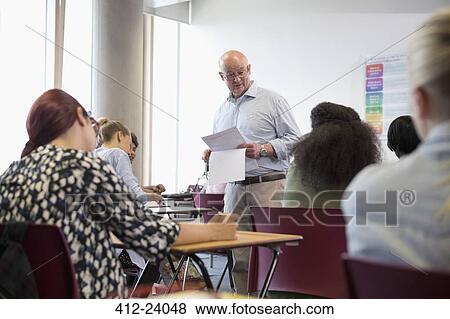 Professor giving exam results to university students View Large Photo Image Stock Photo - Professor giving exam results to university students. Fotosearch