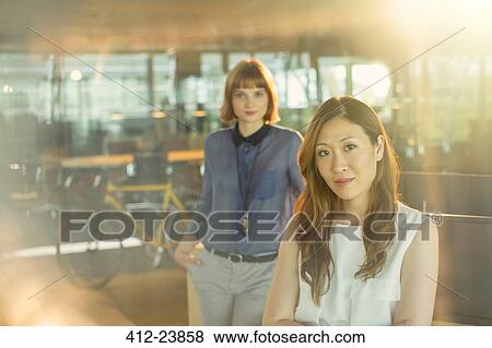 Stock Photo - Serious businesswomen in office. Fotosearch
