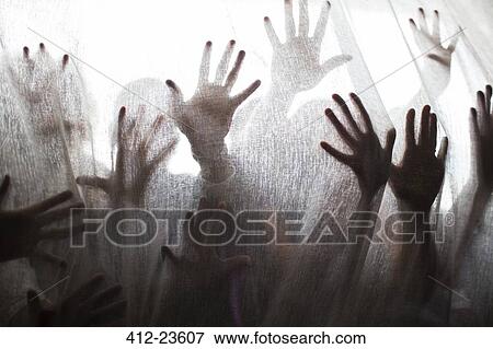 Silhouette of people raising hands behind transparent curtain View Large Photo Image Stock Photo - Silhouette of people raising hands behind transparent curtain. Fotosearch