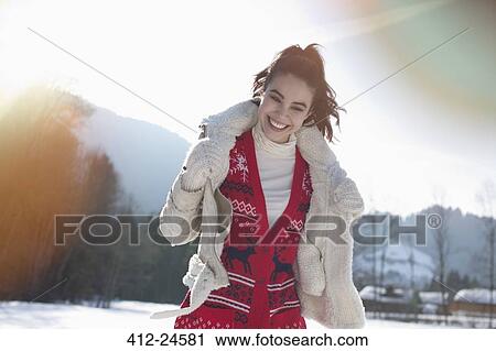 Smiling woman in snowy field View Large Photo Image Stock Image - Smiling woman in snowy field. Fotosearch