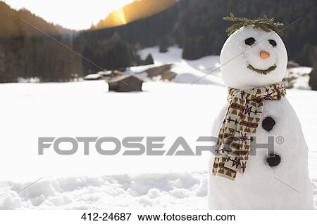 Snowman in sunny field View Large Photo Image Stock Photo - Snowman in sunny field. Fotosearch
