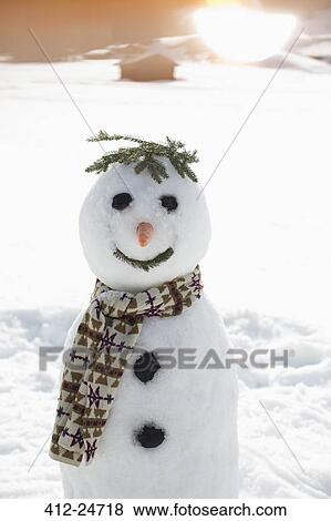 Stock Photo - Snowman in sunny field. Fotosearch
