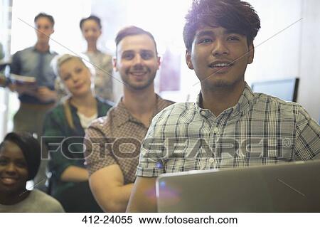 Stock Photography - Students listening during seminar. Fotosearch