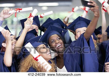 Students taking selfie after graduation ceremony View Large Photo Image Stock Photo - Students taking selfie after graduation ceremony. Fotosearch