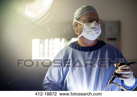 Surgeon performing laparoscopic surgery in operating theater View Large Photo Image Stock Image - Surgeon performing laparoscopic surgery in operating theater. Fotosearch