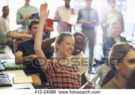 University student raising hand at IT seminar View Large Photo Image Stock Photograph - University student raising hand at IT seminar. Fotosearch