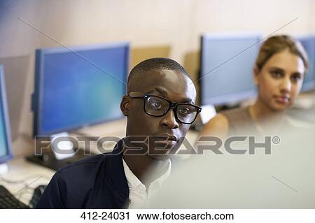 University student with raised eyebrow during seminar in classroom View Large Photo Image Stock Image - University student with raised eyebrow during seminar in classroom. Fotosearch