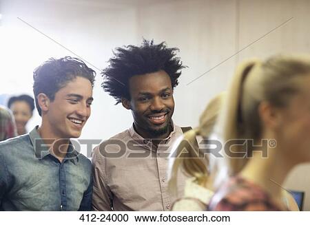 University students chatting during break in classroom View Large Photo Image Stock Image - University students chatting during break in classroom. Fotosearch