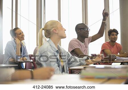 Stock Photography - University students listening attentively at seminar. Fotosearch