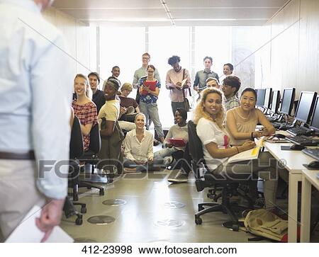 Stock Photo - University students listening to presentation in IT classroom. Fotosearch