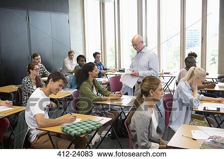 University students receiving test results from professor View Large Photo Image Stock Image - University students receiving test results from professor. Fotosearch