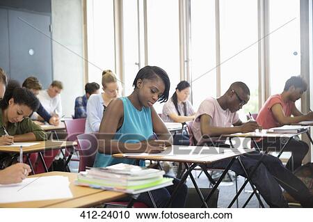 University students taking exam at classroom View Large Photo Image Stock Image - University students taking exam at classroom. Fotosearch