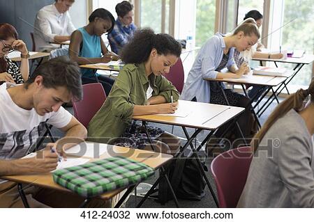 University students taking exam in classroom View Large Photo Image Stock Image - University students taking exam in classroom. Fotosearch