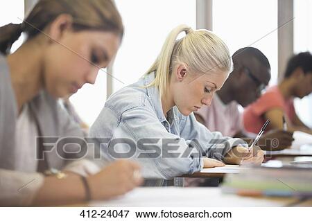University students taking exam View Large Photo Image Stock Photo - University students taking exam. Fotosearch