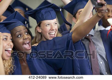 University students taking selfie after graduating View Large Photo Image Stock Photo - University students taking selfie after graduating. Fotosearch