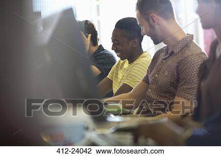 University students talking and studying on computers in classroom View Large Photo Image Stock Image - University students talking and studying on computers in classroom. Fotosearch