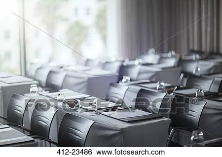 Stock Photograph - View of empty conference room with tables. Fotosearch