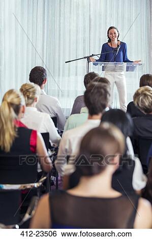 Young businesswoman giving presentation in conference room View Large Photo Image Stock Photograph - Young businesswoman giving presentation in conference room. Fotosearch