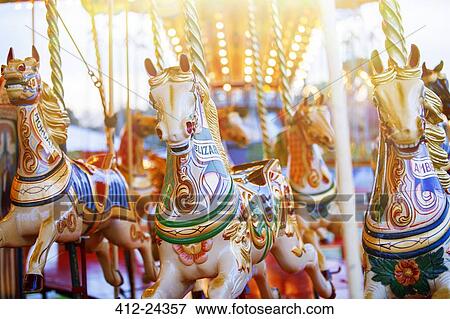 Carousel horses in amusement park View Large Photo Image Stock Photo - Carousel horses in amusement park. Fotosearch