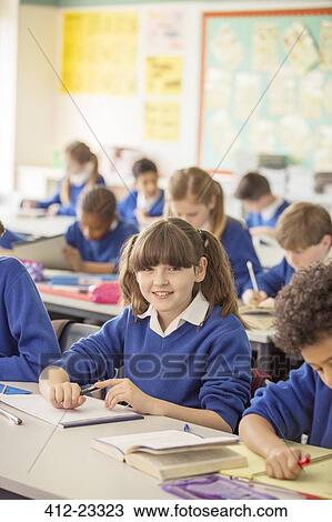 Elementary school children in classroom during lesson View Large Photo Image Stock Image - Elementary school children in classroom during lesson. Fotosearch