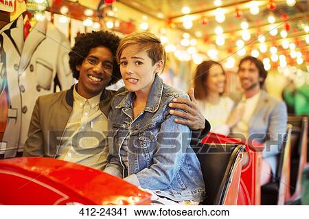Man embracing scared girlfriend on ghost train View Large Photo Image Stock Image - Man embracing scared girlfriend on ghost train. Fotosearch