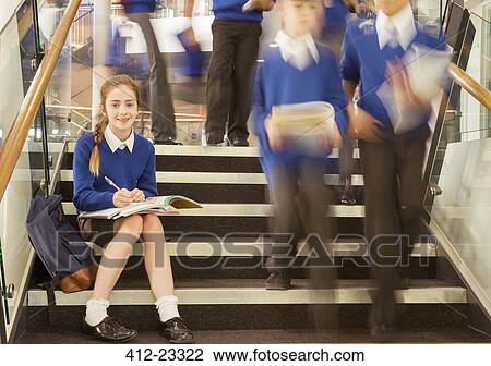Portrait of smiling elementary school girl sitting on steps in school View Large Photo Image Stock Image - Portrait of smiling elementary school girl sitting on steps in school. Fotosearch