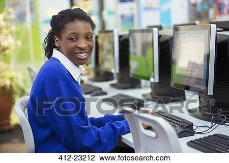 Portrait of smiling female student smiling during IT lesson View Large Photo Image Stock Image - Portrait of smiling female student smiling during IT lesson. Fotosearch