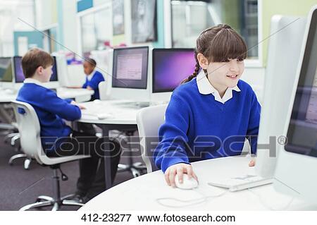 Primary school children working with computers during IT lesson View Large Photo Image Stock Photo - Primary school children working with computers during IT lesson. Fotosearch