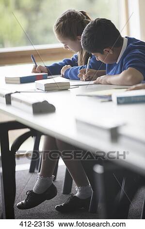 Pupils learning in classroom View Large Photo Image Stock Photography - Pupils learning in classroom. Fotosearch