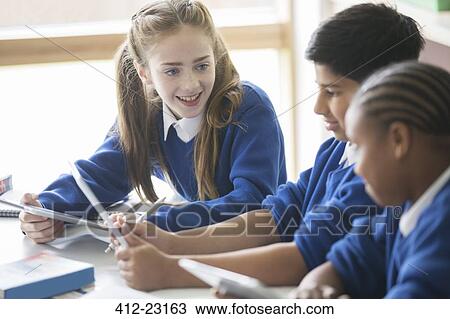 Pupils using tablet pc's in classroom View Large Photo Image Stock Image - Pupils using tablet pc's in classroom. Fotosearch