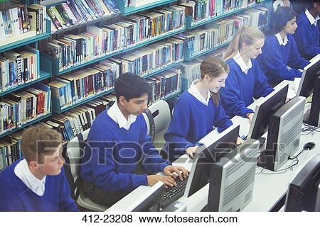 Students working on computers in library View Large Photo Image Stock Photo - Students working on computers in library. Fotosearch