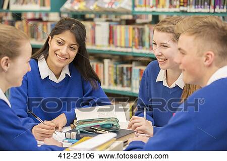 Teenage students learning in library View Large Photo Image Stock Photograph - Teenage students learning in library. Fotosearch
