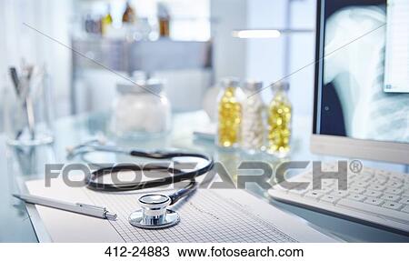 "Chart and stethoscope on desk, x-ray on monitor" View Large Photo Image Stock Image - "Chart and stethoscope on desk, x-ray on monitor". Fotosearch