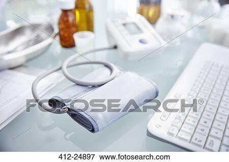 "Desk with pressure gauge, keyboard and flasks with pills" View Large Photo Image Stock Photo - "Desk with pressure gauge, keyboard and flasks with pills". Fotosearch
