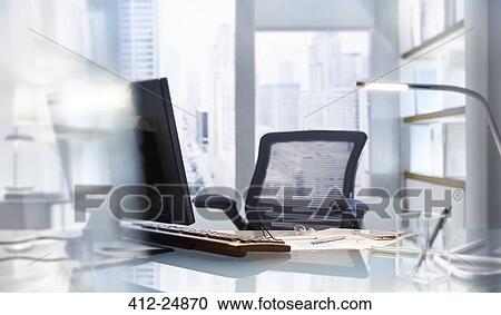 Empty desk in modern office View Large Photo Image Stock Image - Empty desk in modern office. Fotosearch