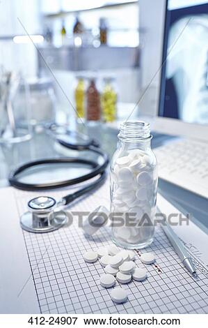 "Flask with white pills, chart and stethoscope on desk" View Large Photo Image Stock Photo - "Flask with white pills, chart and stethoscope on desk". Fotosearch
