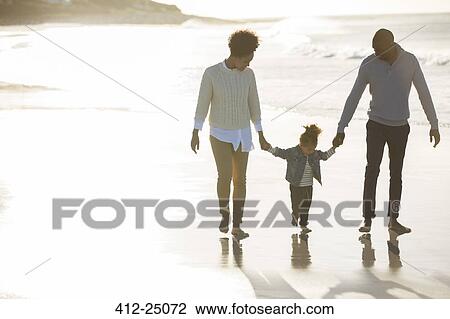 Happy family having fun on beach View Large Photo Image Stock Image - Happy family having fun on beach. Fotosearch
