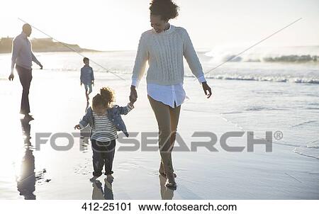 Happy family having fun on beach View Large Photo Image Stock Image - Happy family having fun on beach. Fotosearch